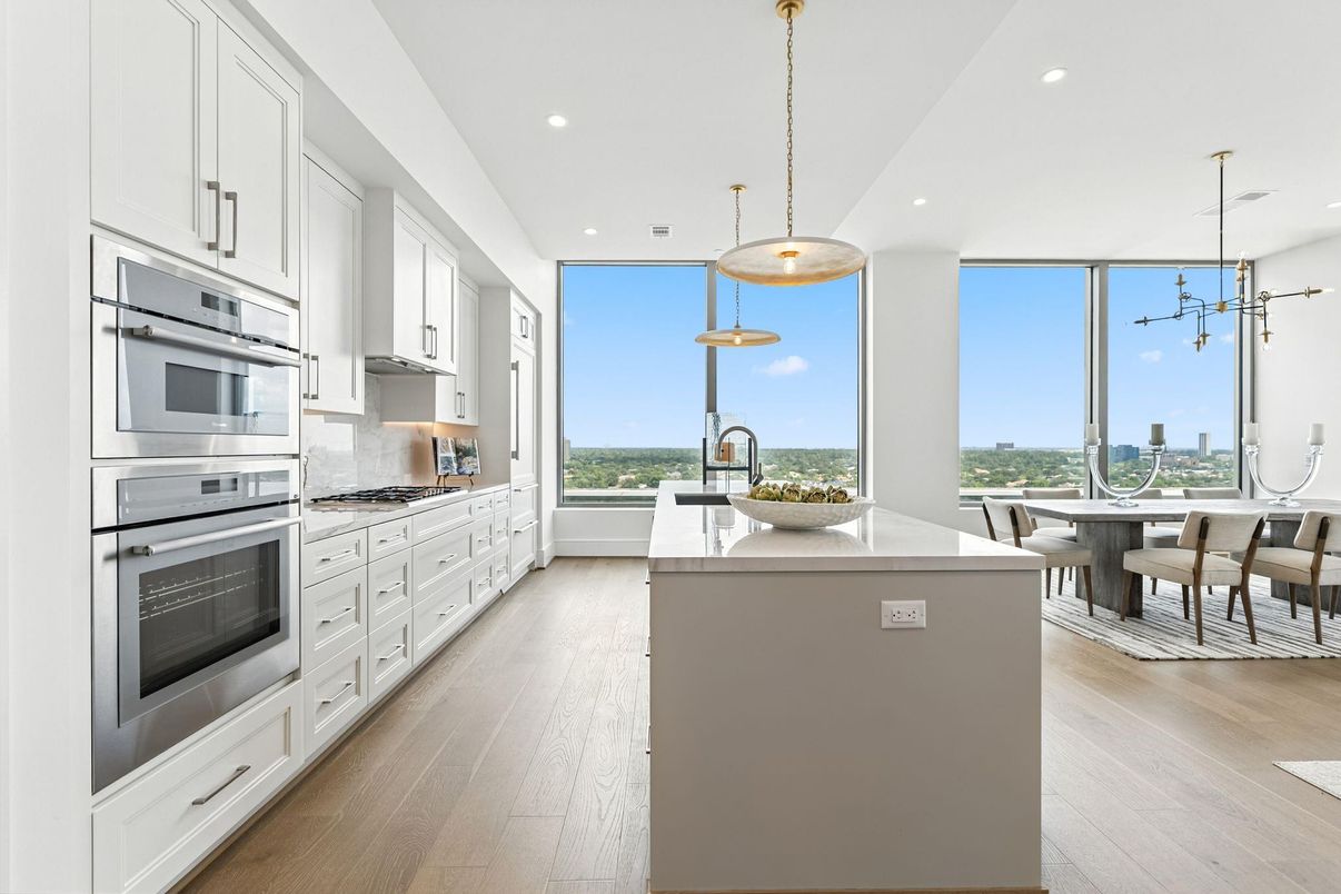 Dining room, Interior, Kitchen, Pendant Lights, Recessed Lighting, Stainless Steel Appliances, Water, Wood Texture Flooring