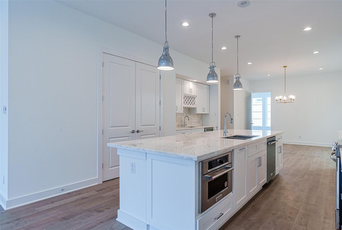 Chandelier, Interior, Kitchen, Pendant Lights, Recessed Lighting, Stainless Steel Appliances, Wood Texture Flooring