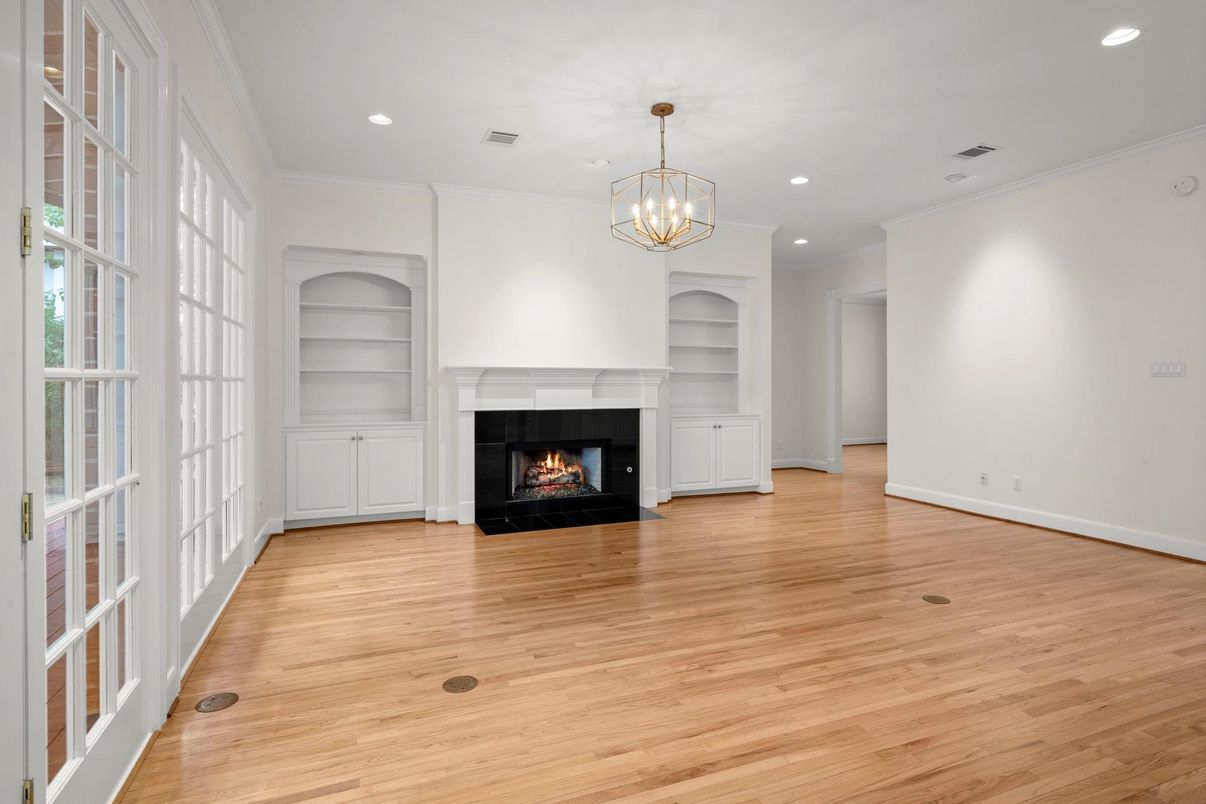 Chandelier, Empty room, Fireplace, Interior, Recessed Lighting, Wood Texture Flooring