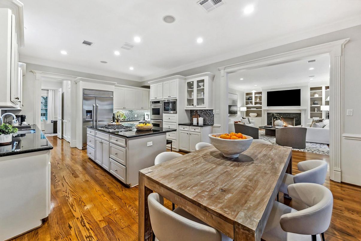 Dining room, Fireplace, Interior, Kitchen, Living room, Recessed Lighting, Stainless Steel Appliances, Wood Texture Flooring