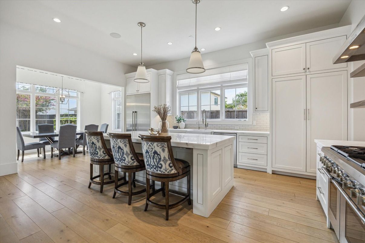 Dining room, Interior, Kitchen, Pendant Lights, Recessed Lighting, Stainless Steel Appliances, Wood Texture Flooring