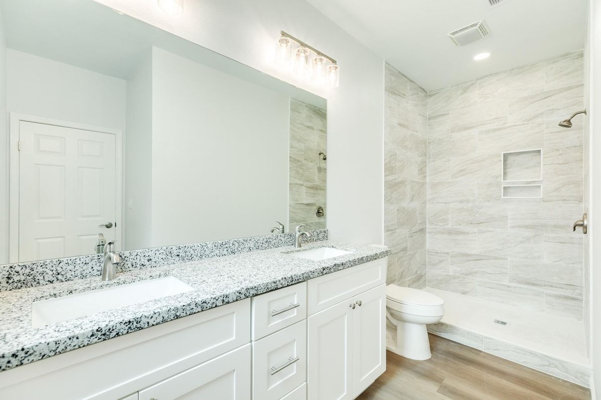 Bathroom, Dual Sink Vanities, Interior, Marble Walls, Recessed Lighting, Wood Texture Flooring