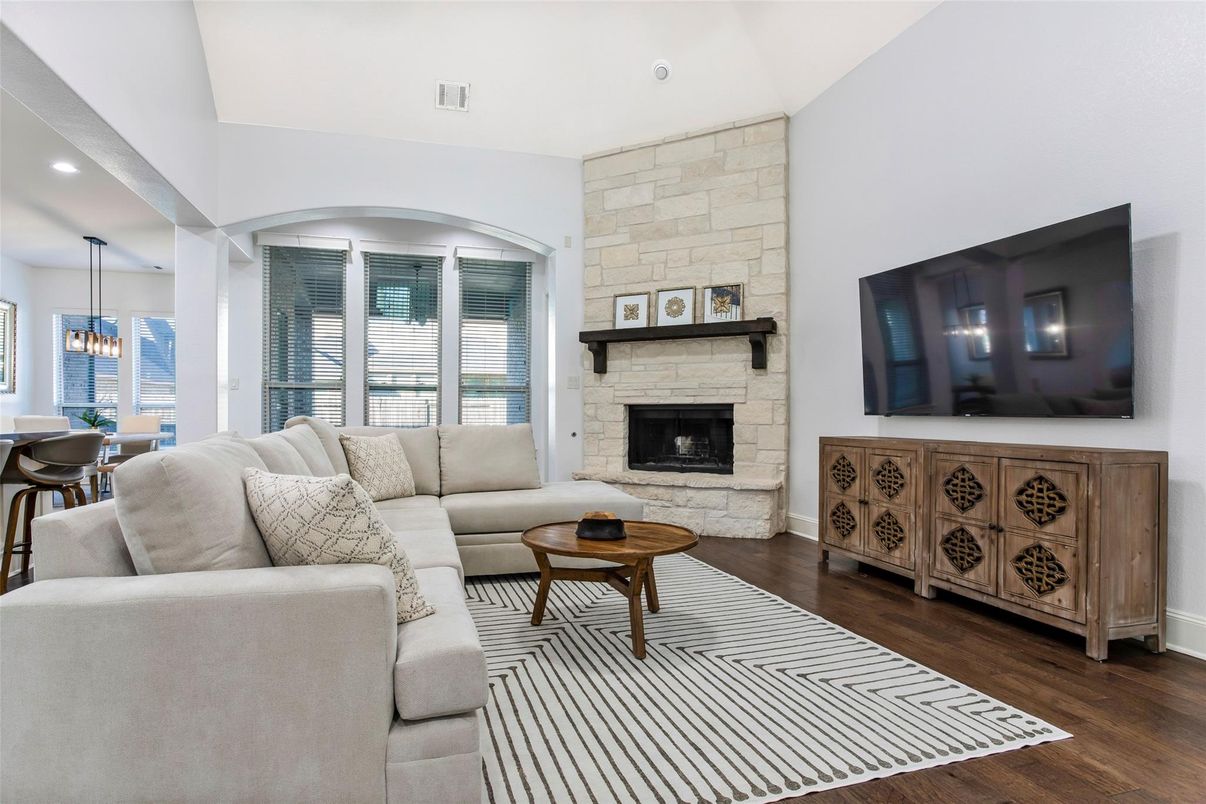 Dining room, Fireplace, Interior, Living room, Pendant Lights, Recessed Lighting, Stone Walls, Wood Texture Flooring
