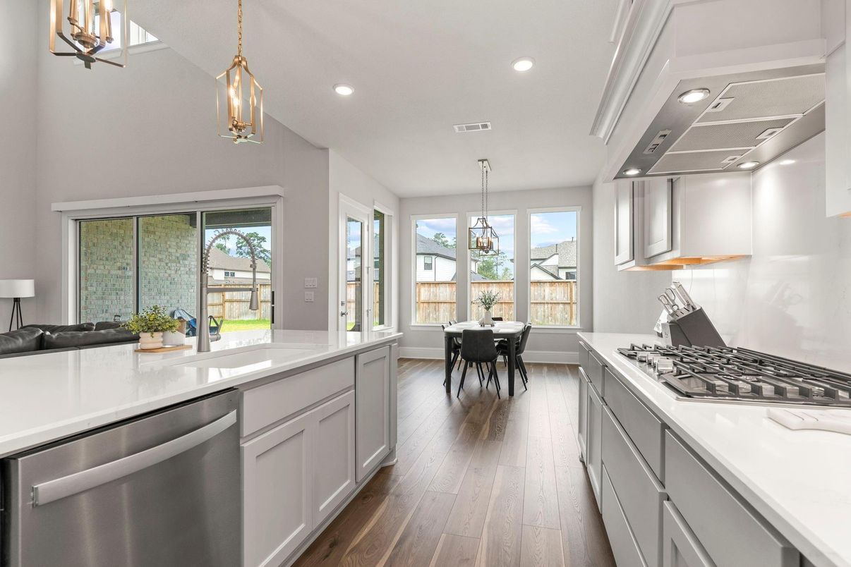 Dining room, Interior, Kitchen, Pendant Lights, Recessed Lighting, Stainless Steel Appliances, Wood Texture Flooring