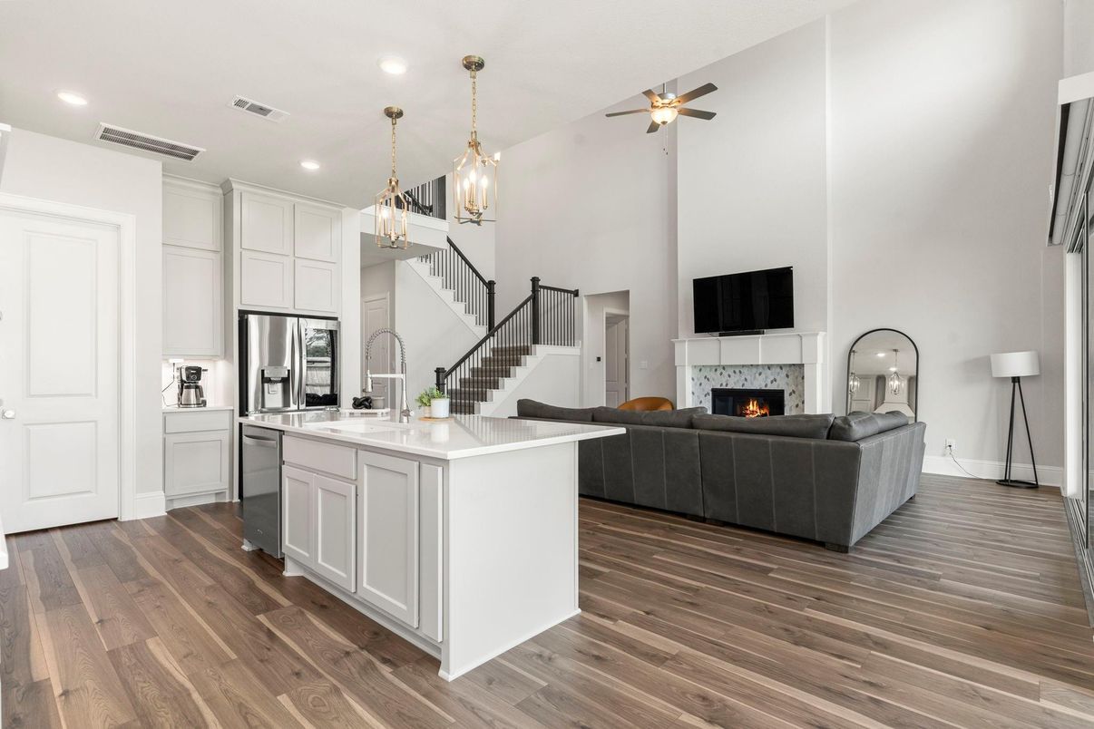Fireplace, Interior, Kitchen, Living room, Pendant Lights, Recessed Lighting, Stainless Steel Appliances, Wood Texture Flooring