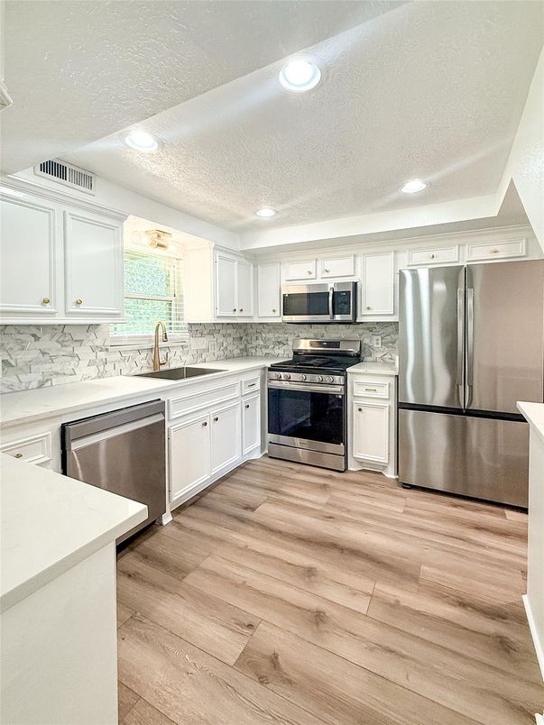 Interior, Kitchen, Recessed Lighting, Stainless Steel Appliances, Wood Texture Flooring