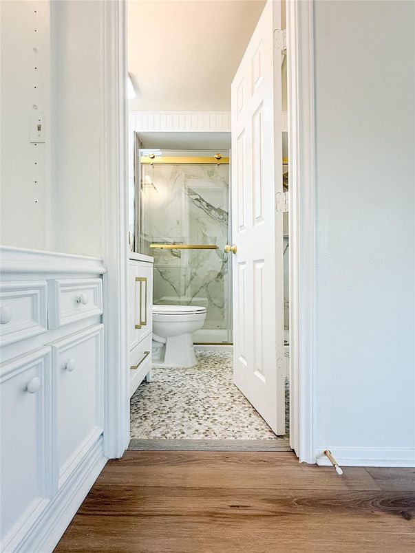 Bathroom, Glass Shower, Interior, Marble Walls, Wood Texture Flooring