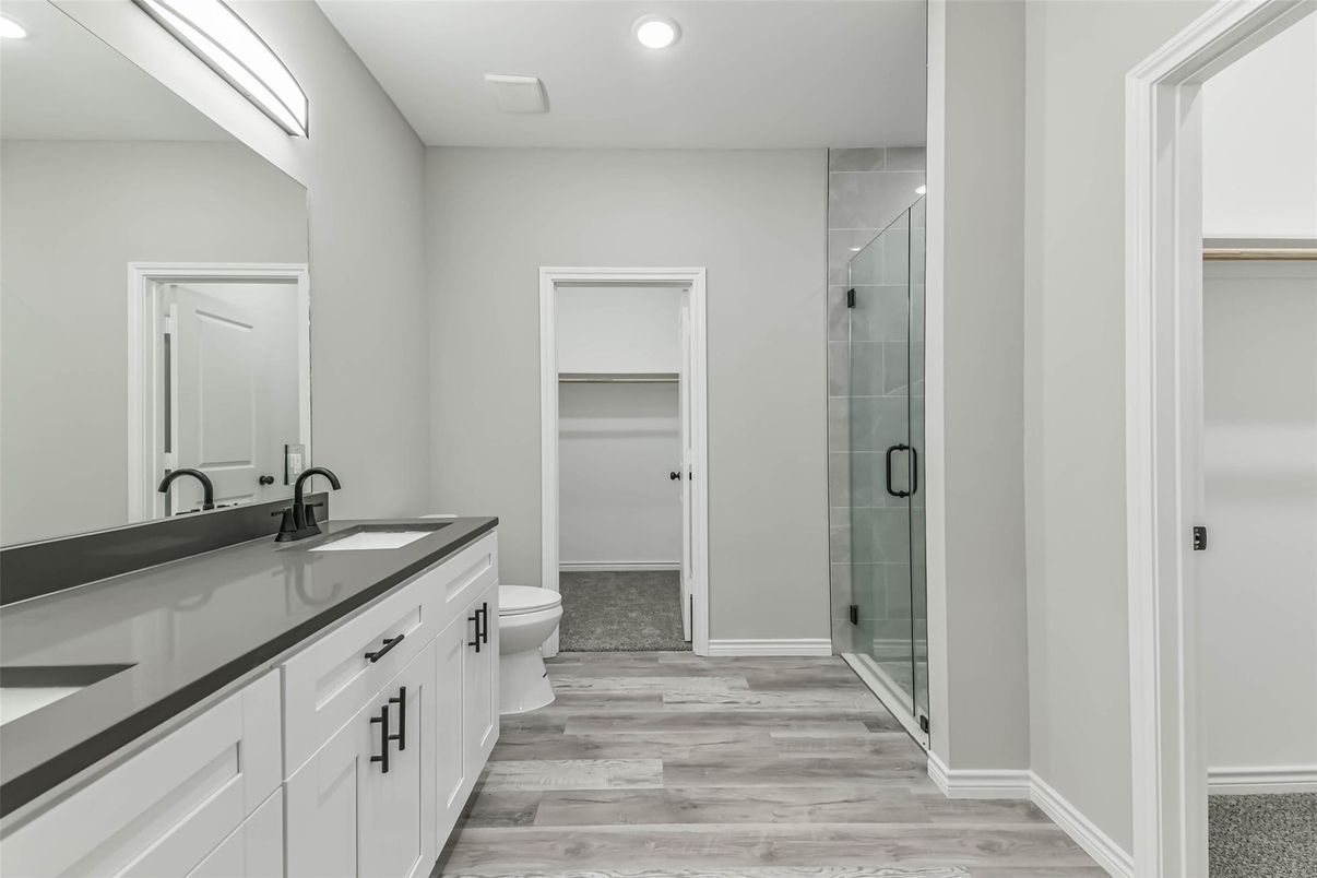 Bathroom, Dual Sink Vanities, Glass Shower, Interior, Recessed Lighting, Wood Texture Flooring