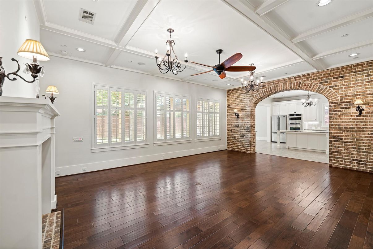 Chandelier, Empty room, Fireplace, Interior, Recessed Lighting, Stone Walls, Wood Texture Flooring