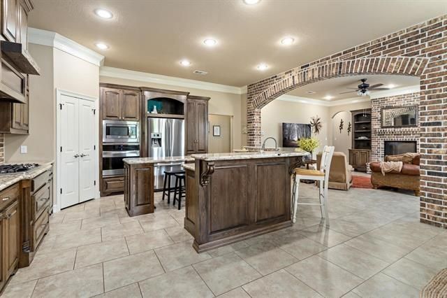 Dining room, Fireplace, Interior, Kitchen, Living room, Recessed Lighting, Stainless Steel Appliances, Stone Walls