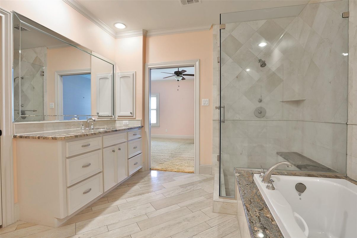 Bathroom, Dual Sink Vanities, Glass Shower, Interior, Recessed Lighting, Wood Texture Flooring