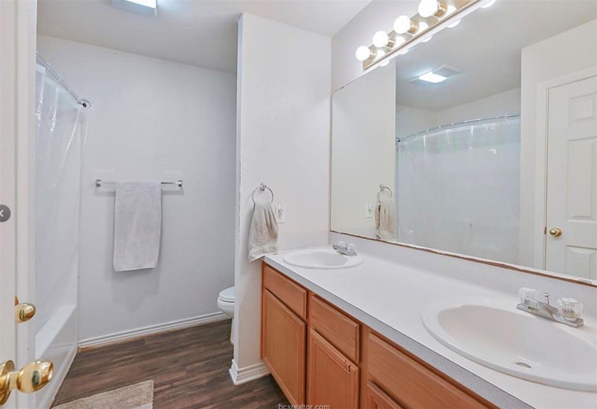 Bathroom, Dual Sink Vanities, Glass Shower, Interior, Wood Texture Flooring