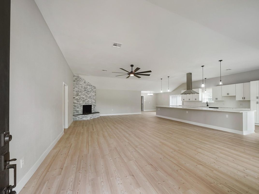 Empty room, Fireplace, Interior, Kitchen, Pendant Lights, Stone Walls, Wood Texture Flooring