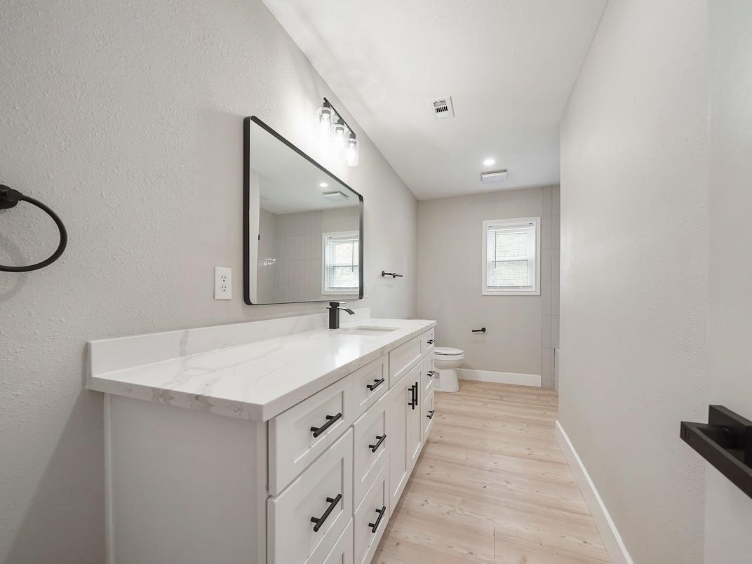 Bathroom, Dual Sink Vanities, Interior, Recessed Lighting, Wood Texture Flooring