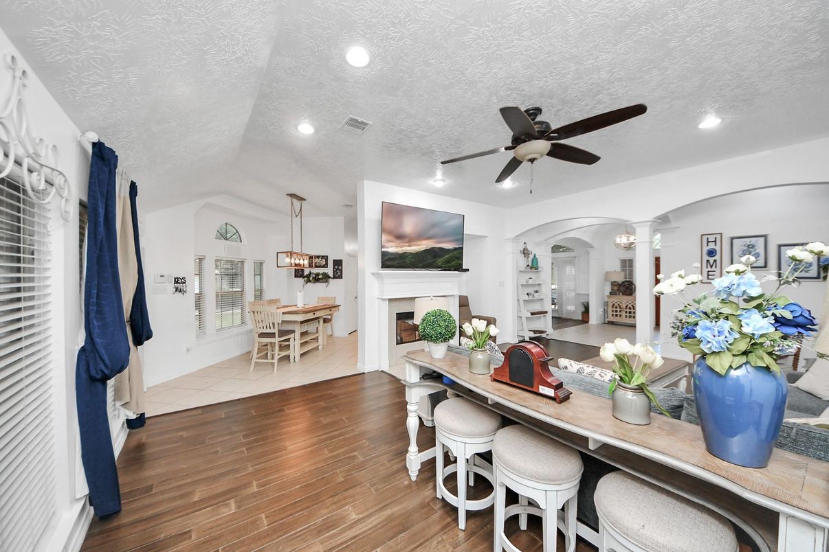 Dining room, Fireplace, Interior, Pendant Lights, Recessed Lighting, Wood Texture Flooring