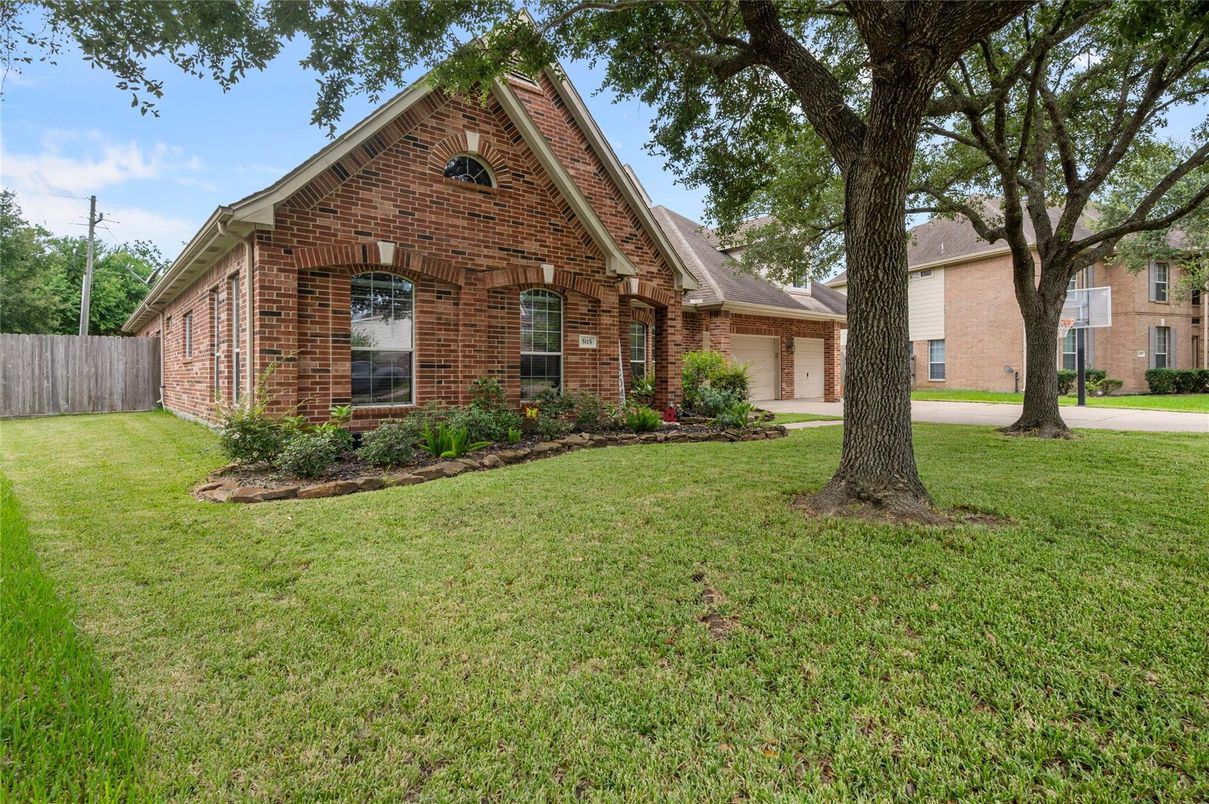 Attached, Backyard, Exterior, Facade, Brick Facade, Brick Traditional