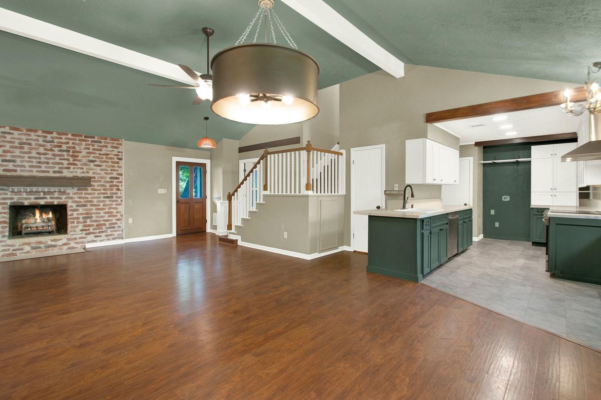 Chandelier, Fireplace, Interior, Kitchen, Pendant Lights, Recessed Lighting, Stone Walls, Wood Texture Flooring