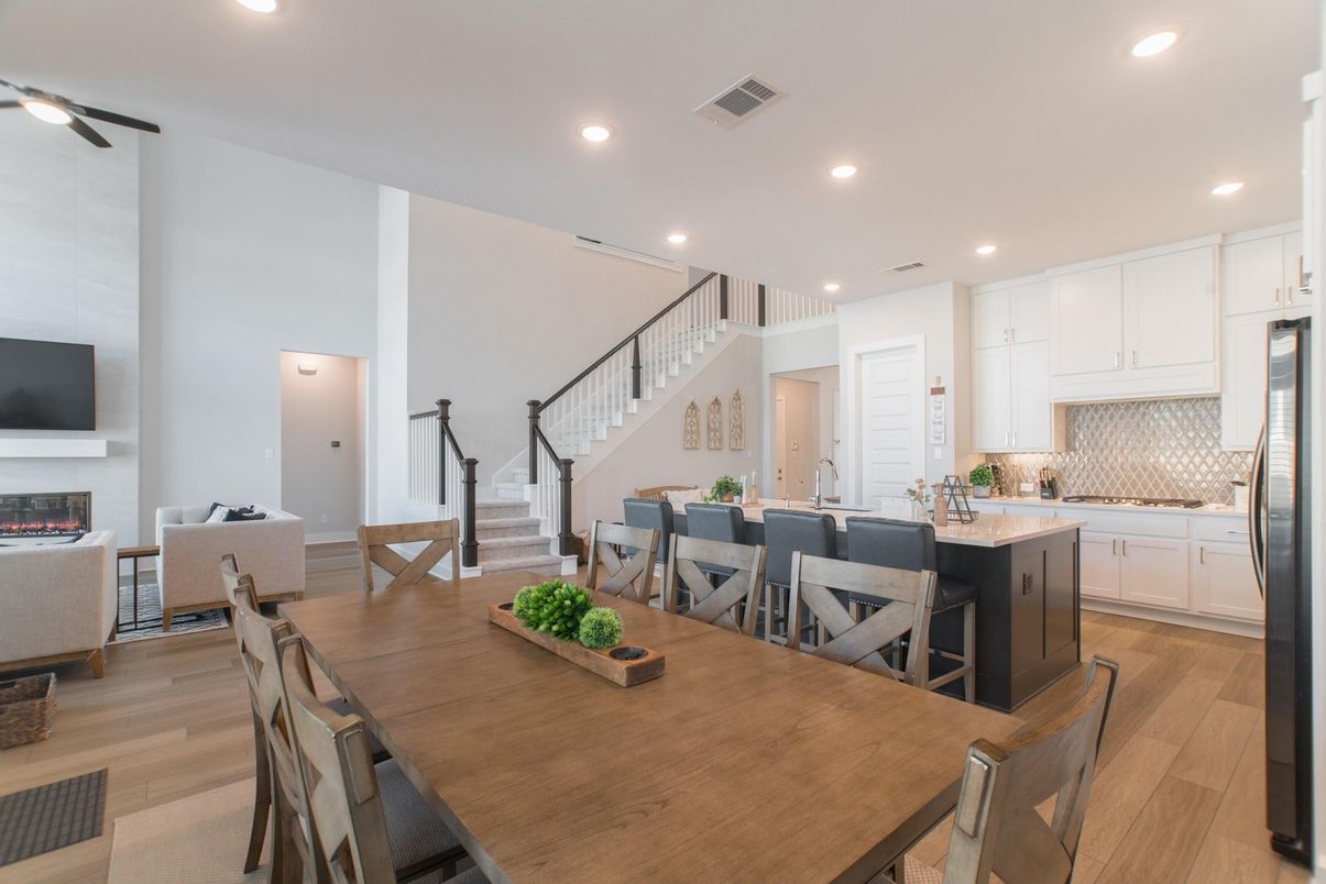 Dining room, Fireplace, Interior, Kitchen, Living room, Pendant Lights, Recessed Lighting, Stainless Steel Appliances, Wood Texture Flooring