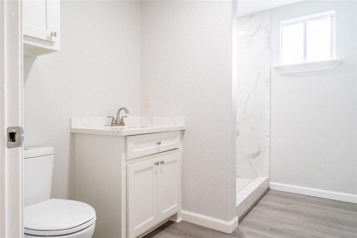 Bathroom, Glass Shower, Interior, Marble Walls, Wood Texture Flooring