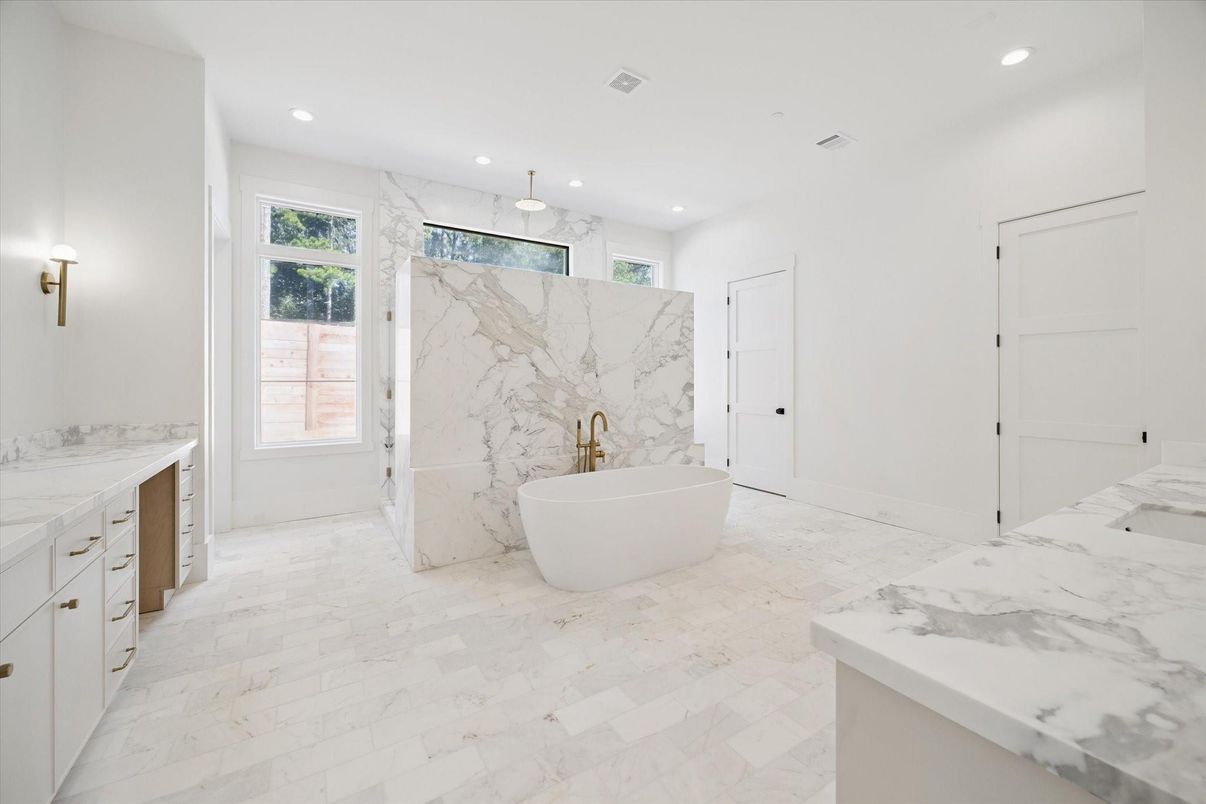 Bathroom, Dual Sink Vanities, Free Standing Baths, Interior, Marble, Marble Walls, Pendant Lights, Recessed Lighting