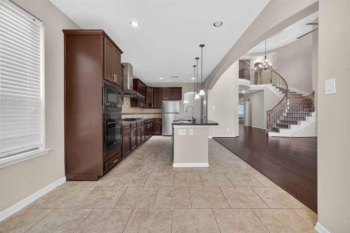 Chandelier, Interior, Kitchen, Pendant Lights, Recessed Lighting, Stainless Steel Appliances, Wood Texture Flooring