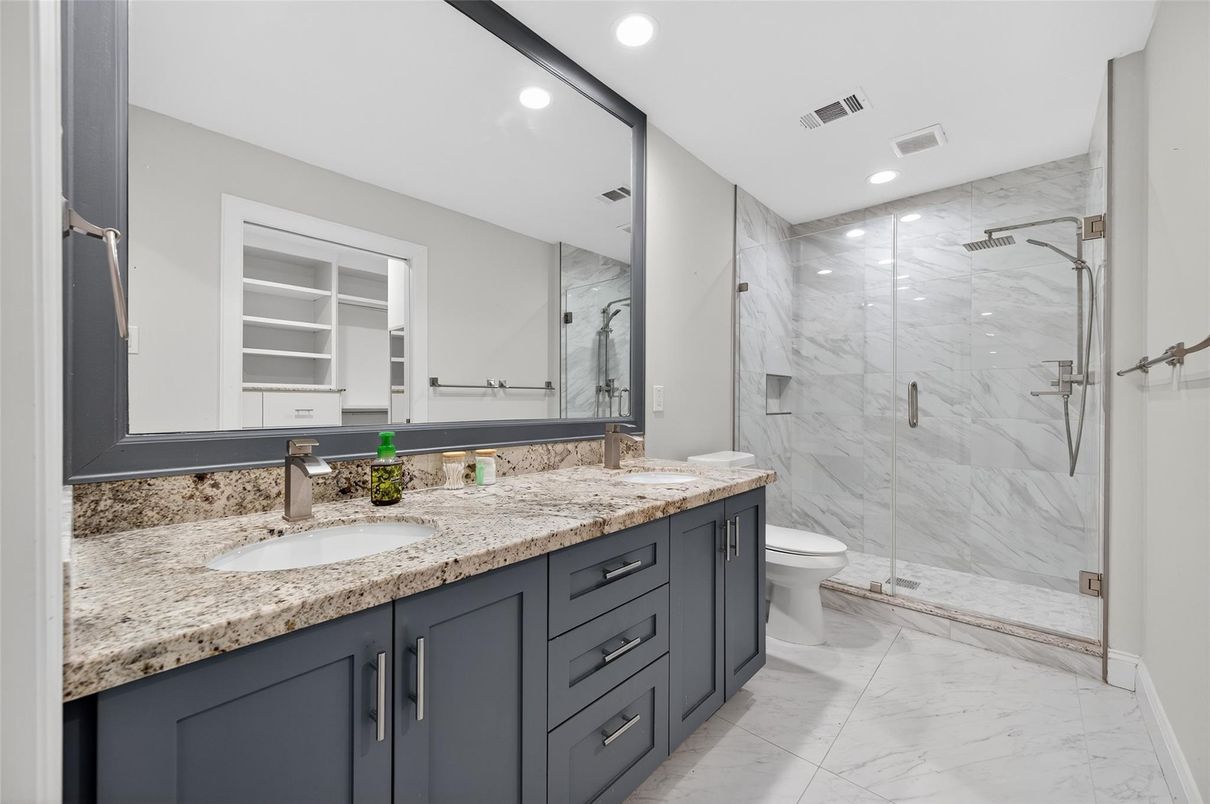 Bathroom, Dual Sink Vanities, Glass Shower, Interior, Marble, Marble Walls, Recessed Lighting