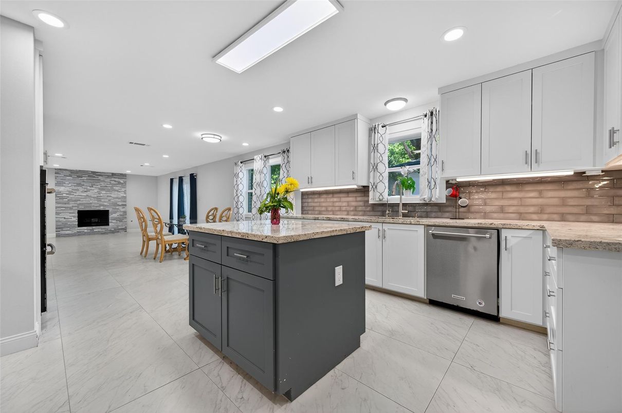 Dining room, Fireplace, Interior, Kitchen, Marble, Recessed Lighting, Stainless Steel Appliances, Stone Walls