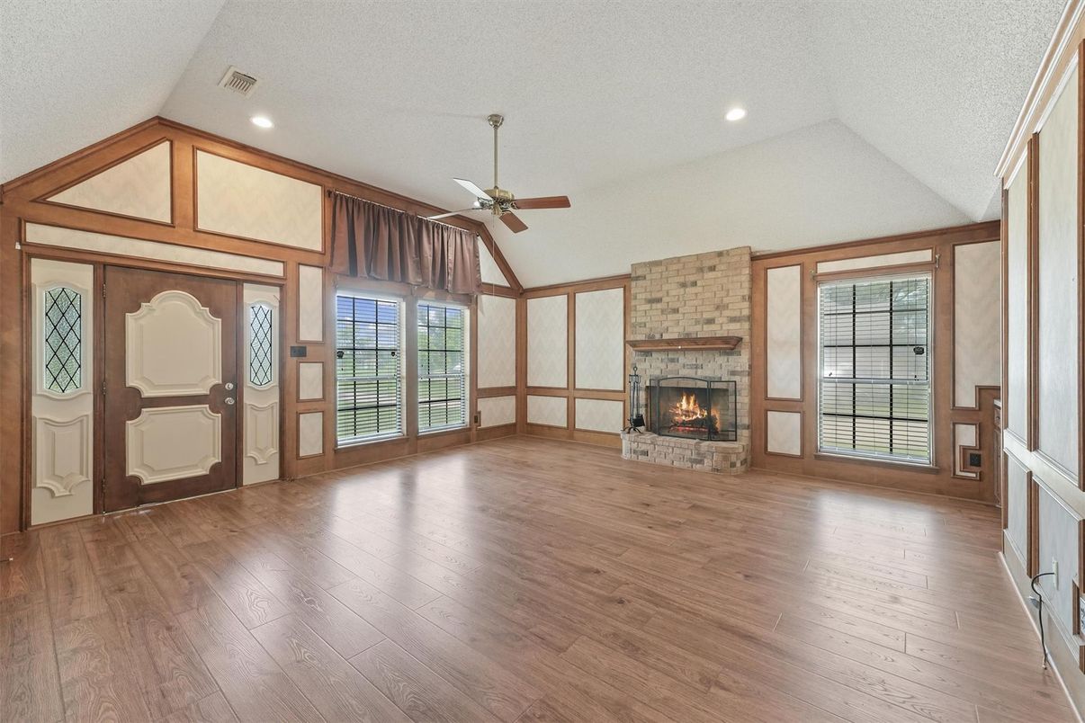 Empty room, Fireplace, Interior, Recessed Lighting, Stone Walls, Wood Texture Flooring