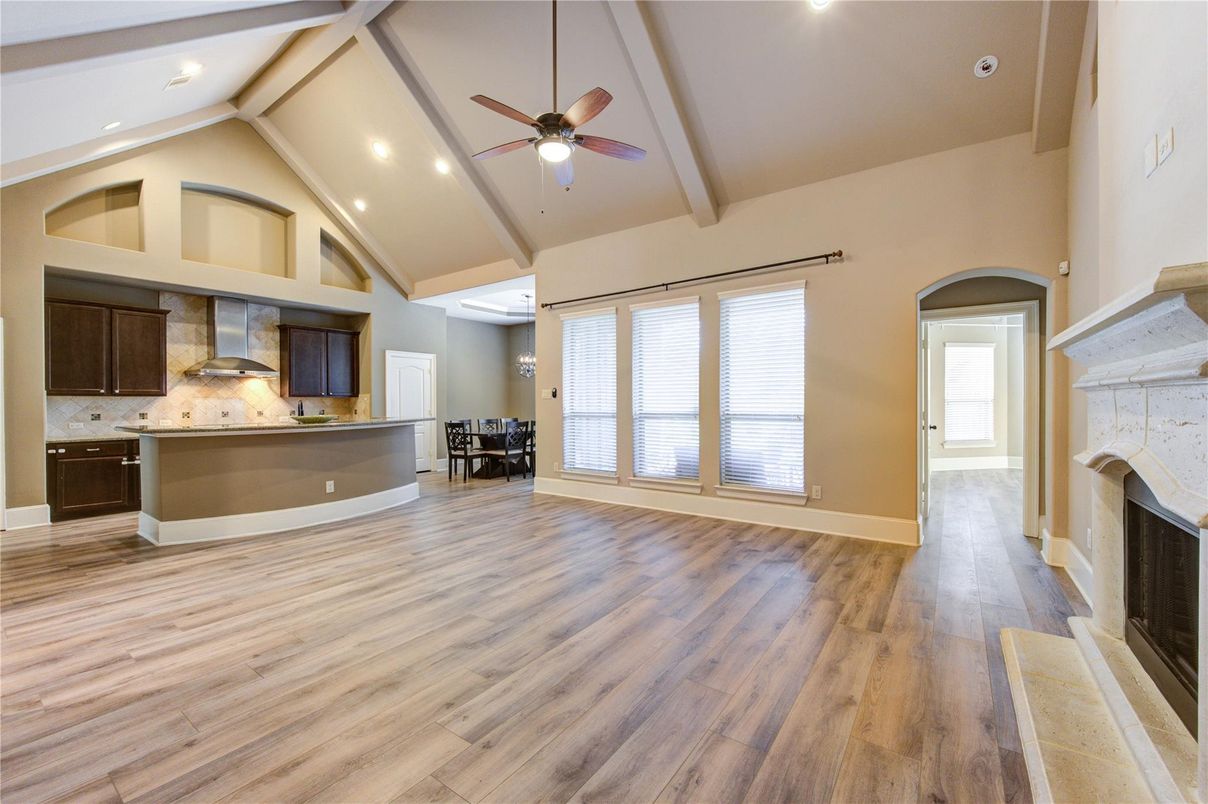 Empty room, Fireplace, Interior, Kitchen, Recessed Lighting, Wood Texture Flooring