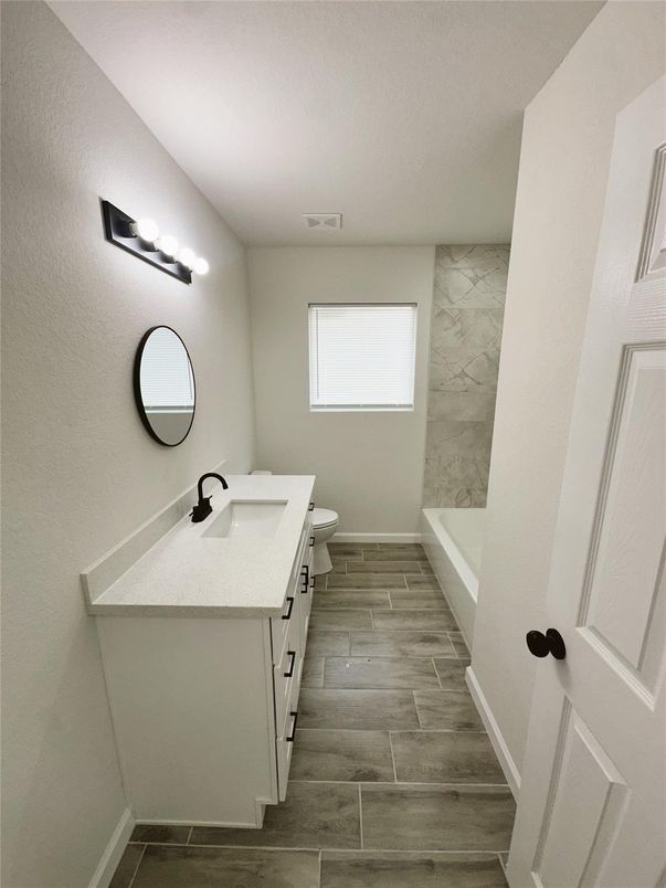 Bathroom, Dual Sink Vanities, Interior, Marble Walls, Wood Texture Flooring