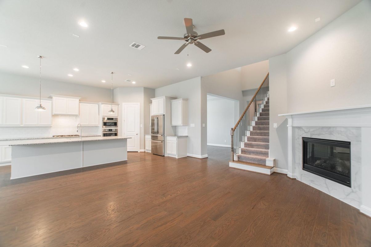 Fireplace, Interior, Kitchen, Pendant Lights, Recessed Lighting, Stainless Steel Appliances, Wood Texture Flooring