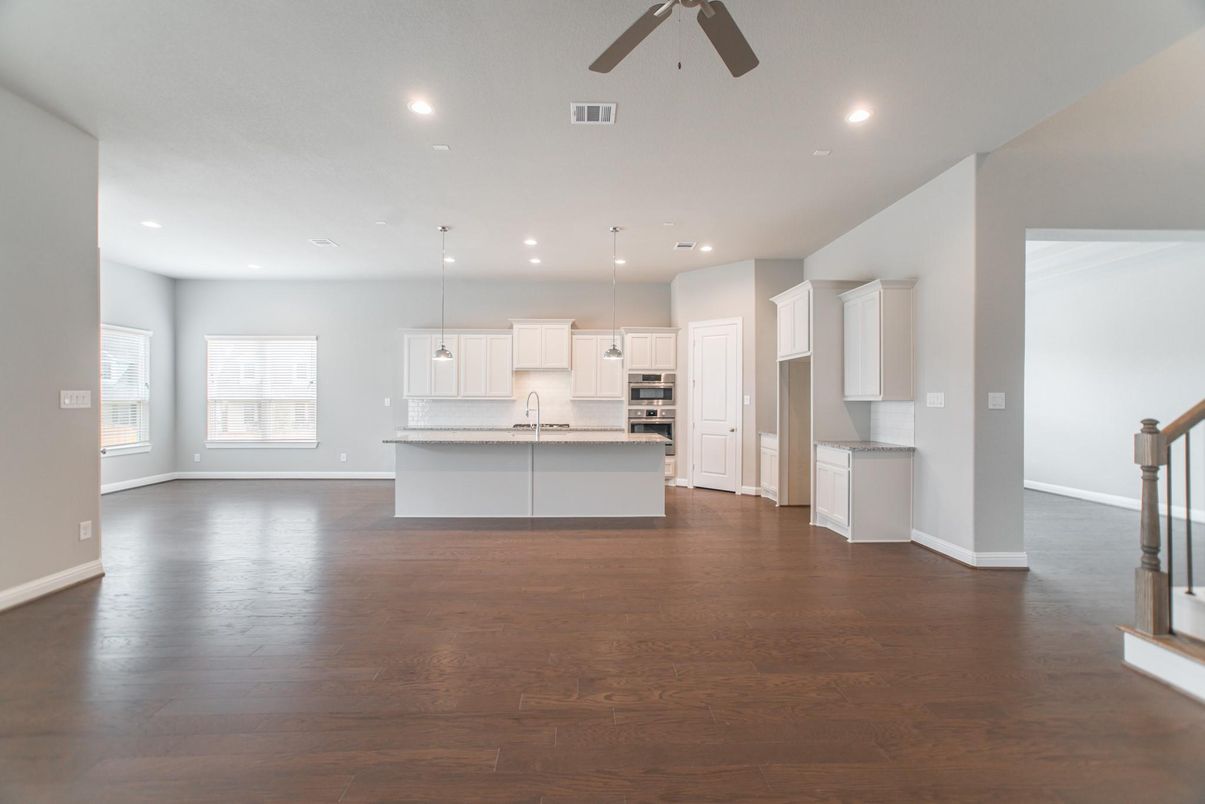 Empty room, Interior, Kitchen, Pendant Lights, Recessed Lighting, Stainless Steel Appliances, Wood Texture Flooring