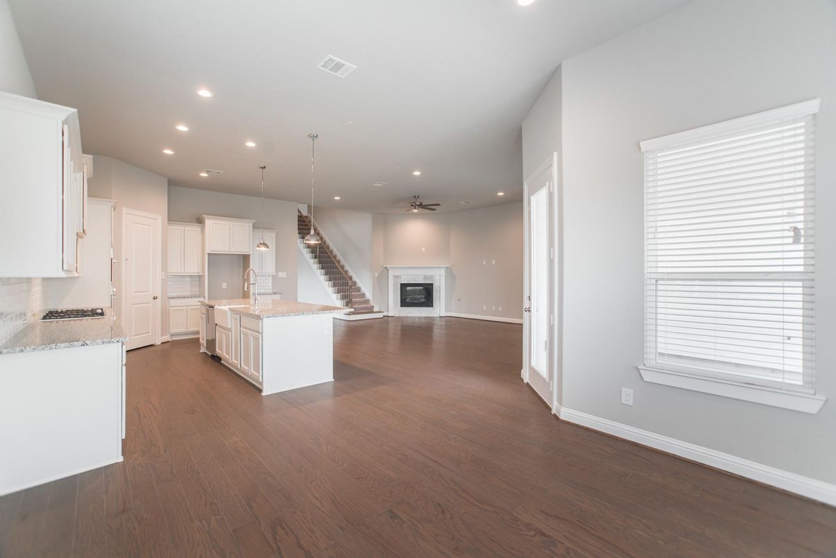 Empty room, Fireplace, Interior, Kitchen, Pendant Lights, Recessed Lighting, Wood Texture Flooring
