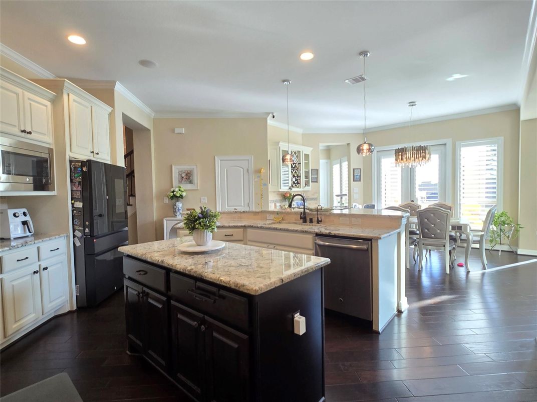 Chandelier, Dining room, Interior, Kitchen, Pendant Lights, Recessed Lighting, Stainless Steel Appliances, Wood Texture Flooring
