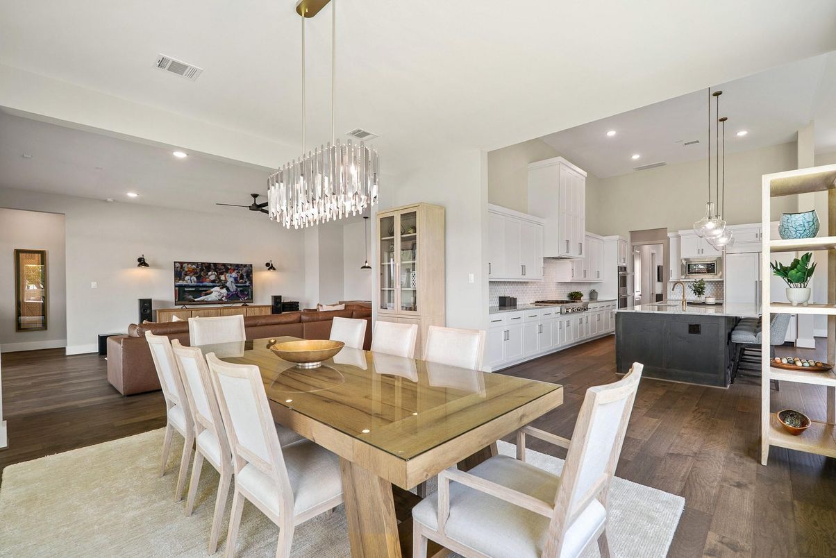 Chandelier, Dining room, Interior, Kitchen, Living room, Pendant Lights, Recessed Lighting, Stainless Steel Appliances, Wood Texture Flooring