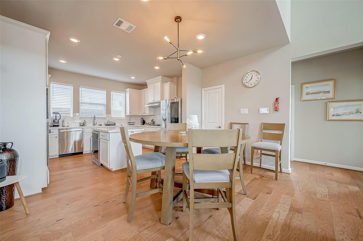 Dining room, Interior, Kitchen, Pendant Lights, Recessed Lighting, Stainless Steel Appliances, Wood Texture Flooring