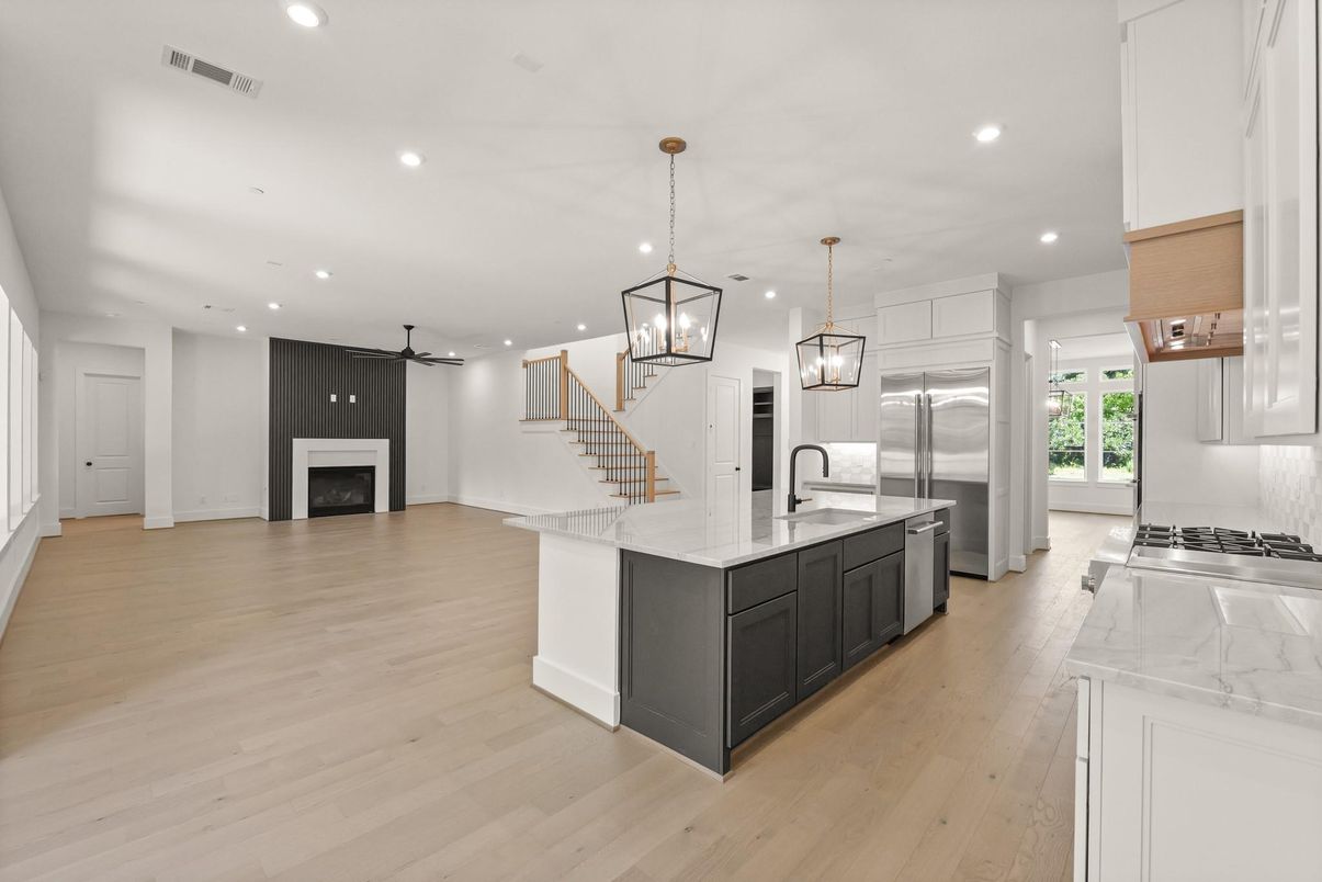 Fireplace, Interior, Kitchen, Pendant Lights, Recessed Lighting, Stainless Steel Appliances, Wood Texture Flooring