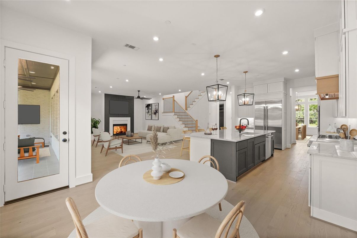 Dining room, Fireplace, Interior, Kitchen, Living room, Pendant Lights, Recessed Lighting, Stainless Steel Appliances, Wood Texture Flooring