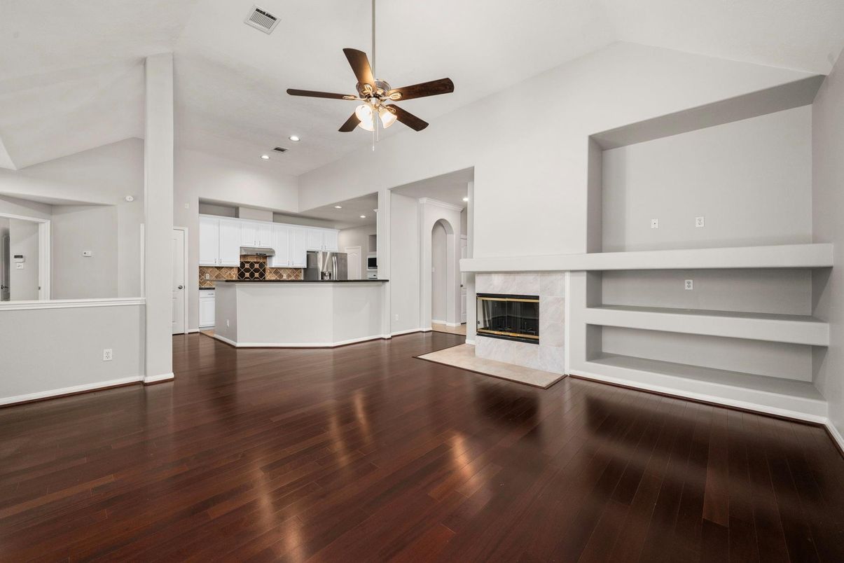 Empty room, Fireplace, Interior, Kitchen, Recessed Lighting, Wood Texture Flooring