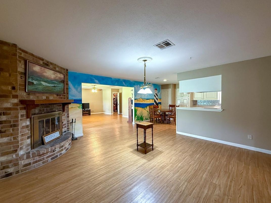 Dining room, Fireplace, Interior, Pendant Lights, Recessed Lighting, Stone Walls, Wood Texture Flooring