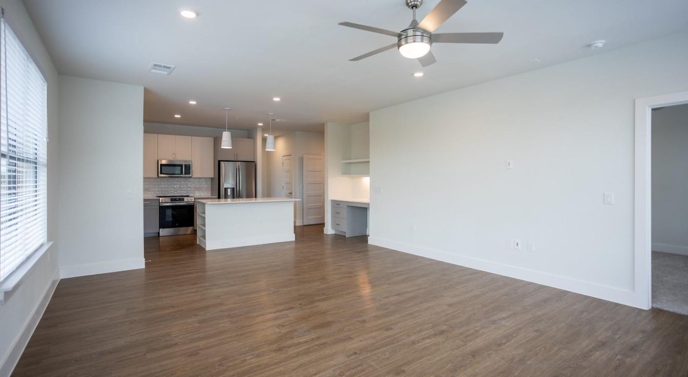 Empty room, Interior, Kitchen, Pendant Lights, Recessed Lighting, Stainless Steel Appliances, Wood Texture Flooring