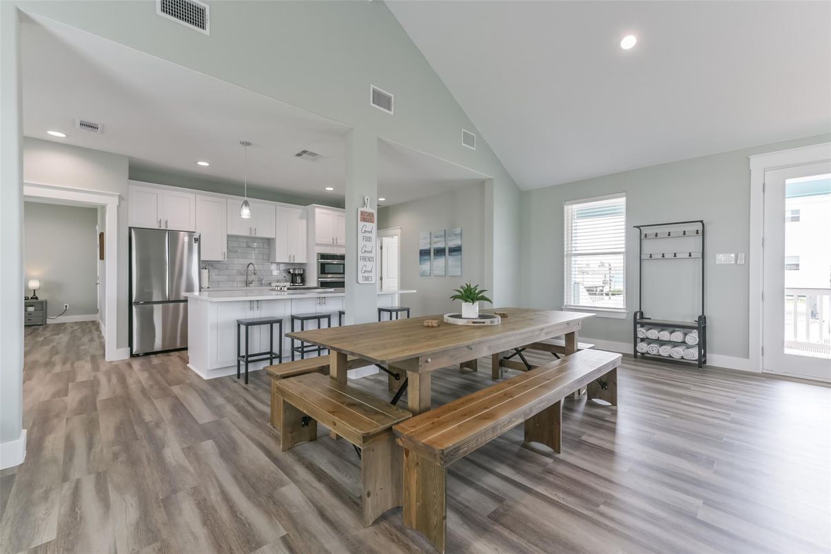 Dining room, Interior, Kitchen, Pendant Lights, Recessed Lighting, Stainless Steel Appliances, Wood Texture Flooring
