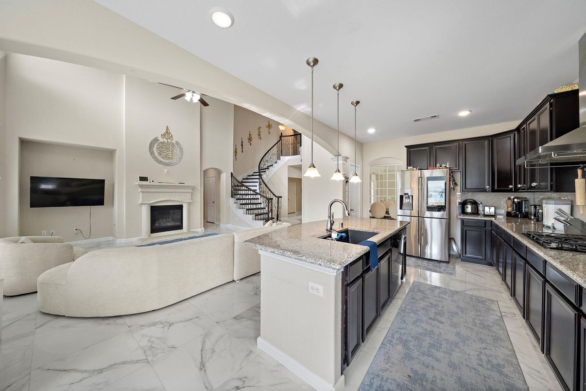 Fireplace, Interior, Kitchen, Living room, Marble, Pendant Lights, Recessed Lighting, Stainless Steel Appliances