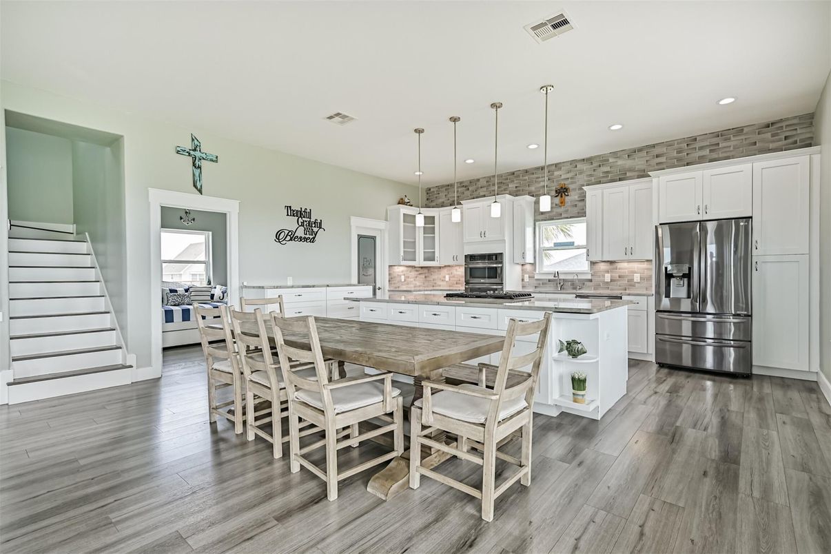 Dining room, Interior, Kitchen, Pendant Lights, Recessed Lighting, Stainless Steel Appliances, Wood Texture Flooring