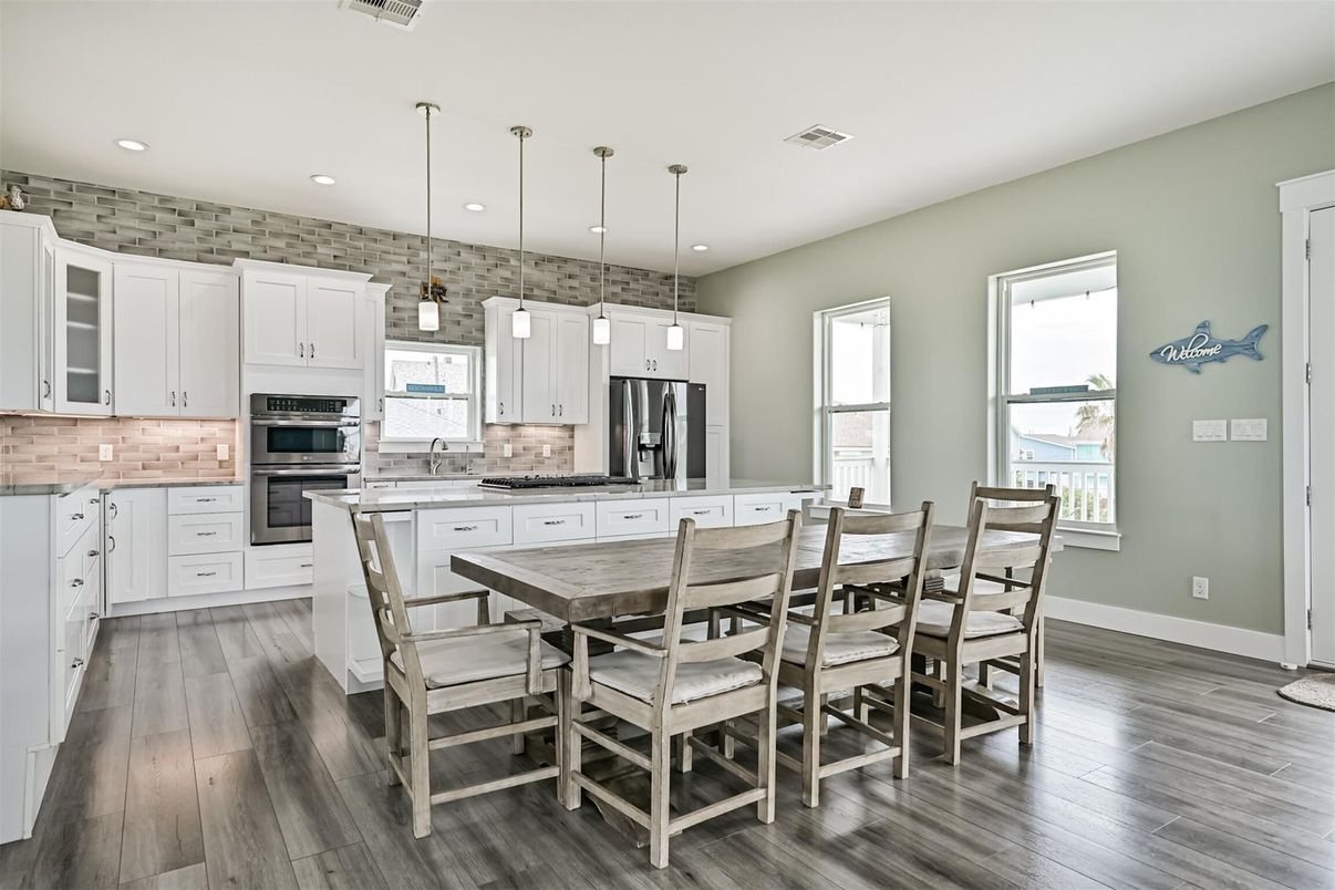 Dining room, Interior, Kitchen, Pendant Lights, Recessed Lighting, Stainless Steel Appliances, Wood Texture Flooring