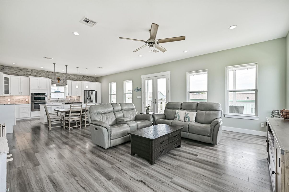Dining room, Interior, Kitchen, Living room, Pendant Lights, Recessed Lighting, Stainless Steel Appliances, Wood Texture Flooring