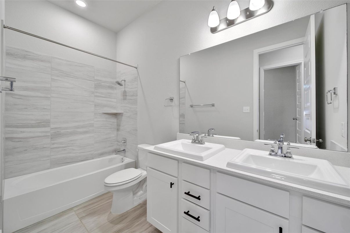 Bathroom, Dual Sink Vanities, Interior, Marble Walls, Recessed Lighting, Wood Texture Flooring