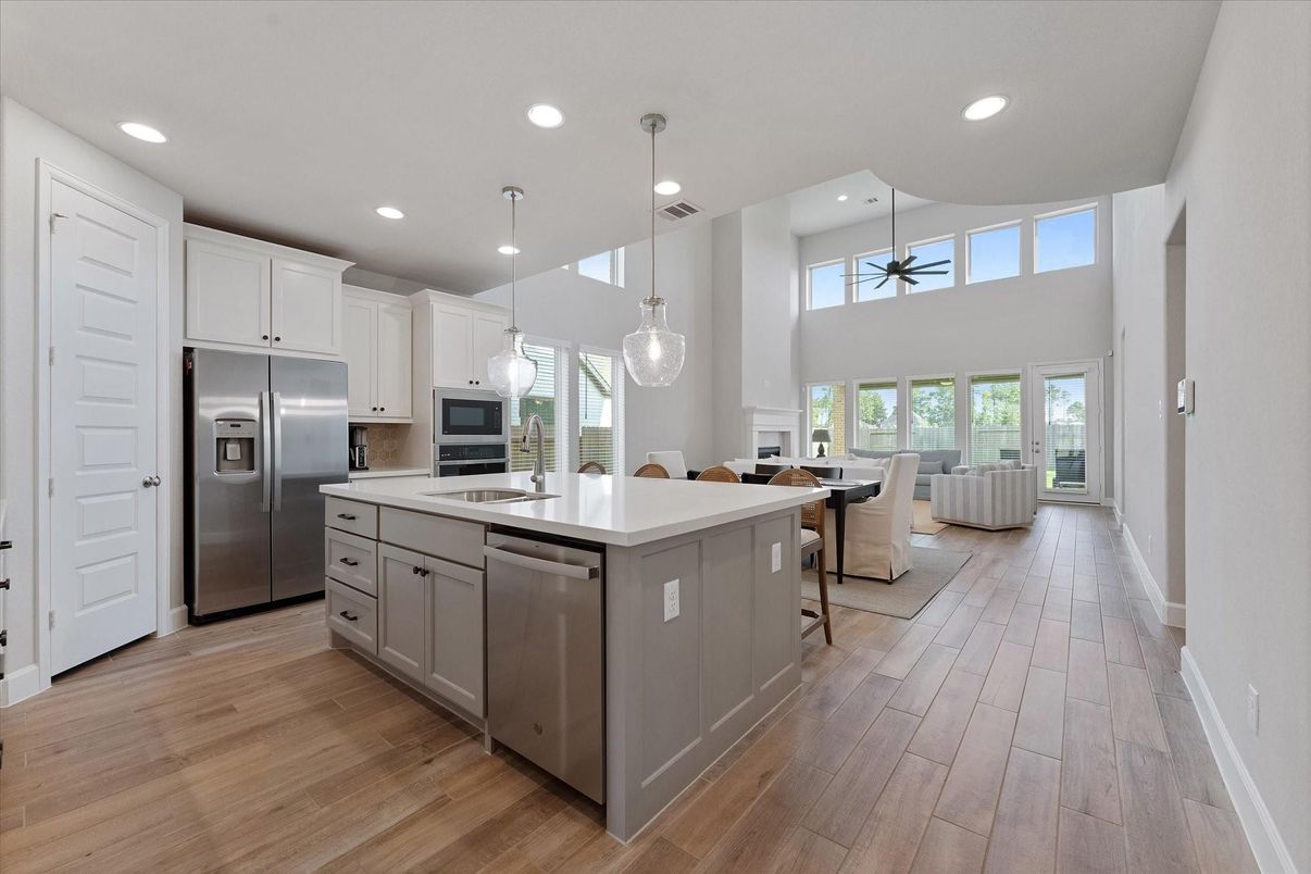 Dining room, Interior, Kitchen, Pendant Lights, Recessed Lighting, Stainless Steel Appliances, Wood Texture Flooring