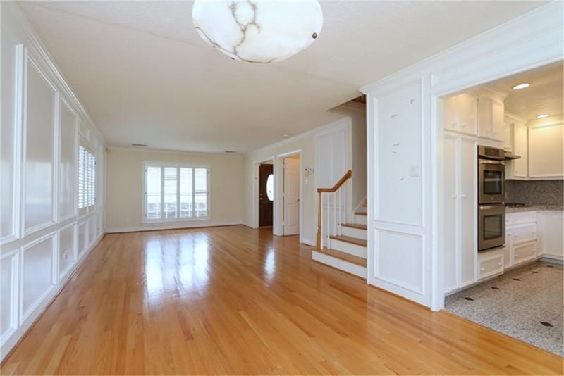 Empty room, Interior, Kitchen, Recessed Lighting, Stainless Steel Appliances, Wood Texture Flooring