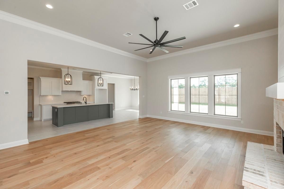 Empty room, Fireplace, Interior, Kitchen, Pendant Lights, Recessed Lighting, Wood Texture Flooring